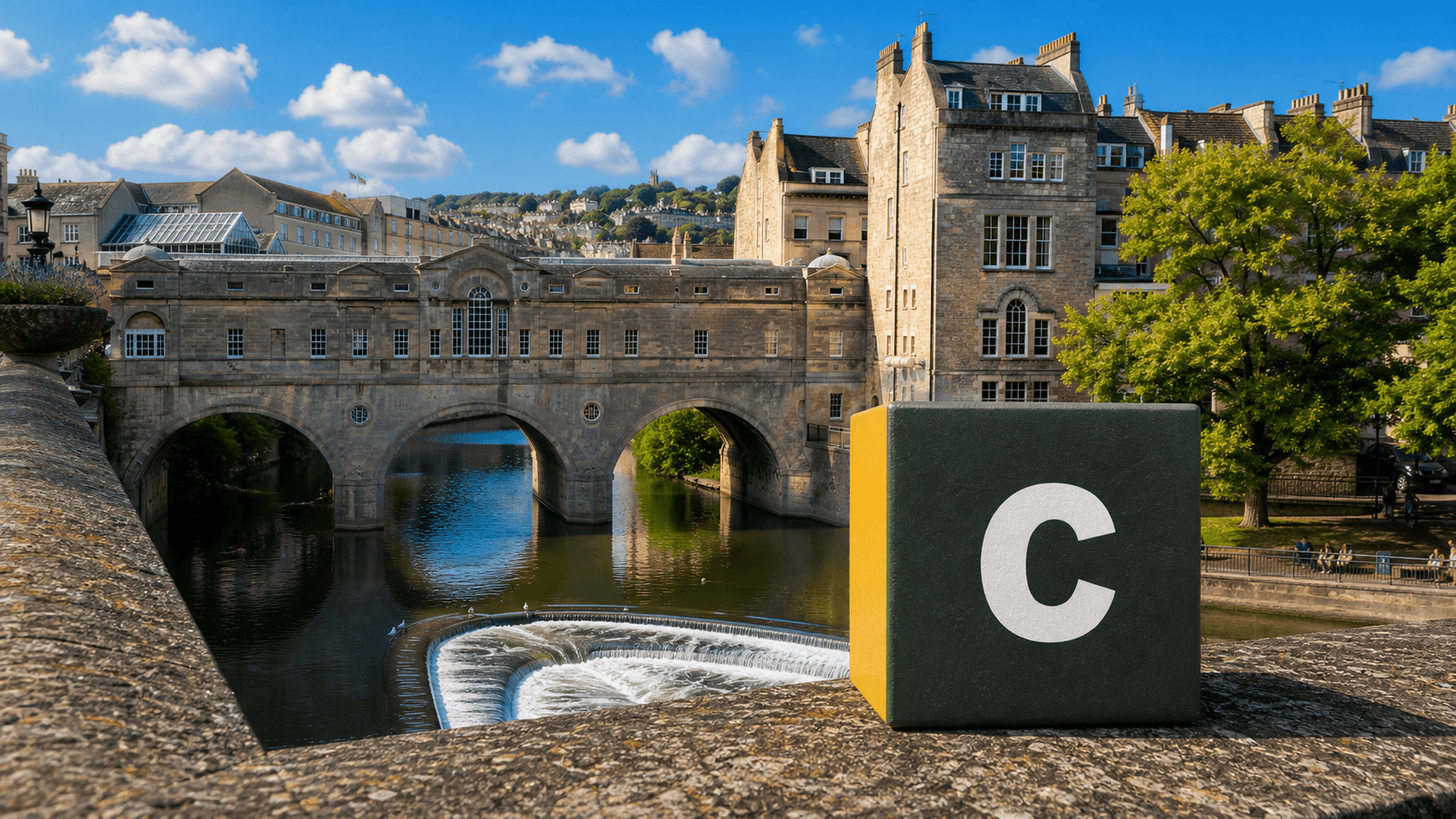 AI training in Bath with a realistic Coaley Peak branded 3D cube at Pulteney Bridge