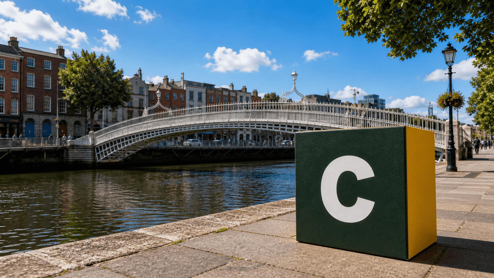 AI training in Dublin with a realistic Coaley Peak branded 3D cube at the Ha'penny Bridge and River Liffey