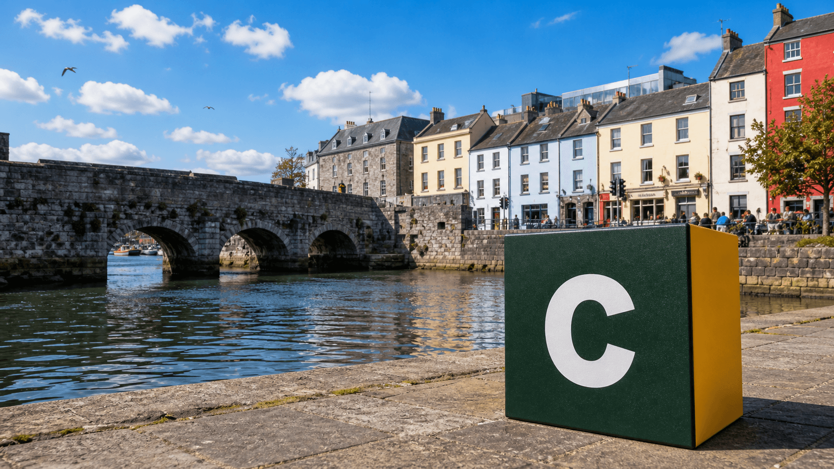 AI training in Galway with a realistic Coaley Peak branded 3D cube at the Spanish Arch and River Corrib