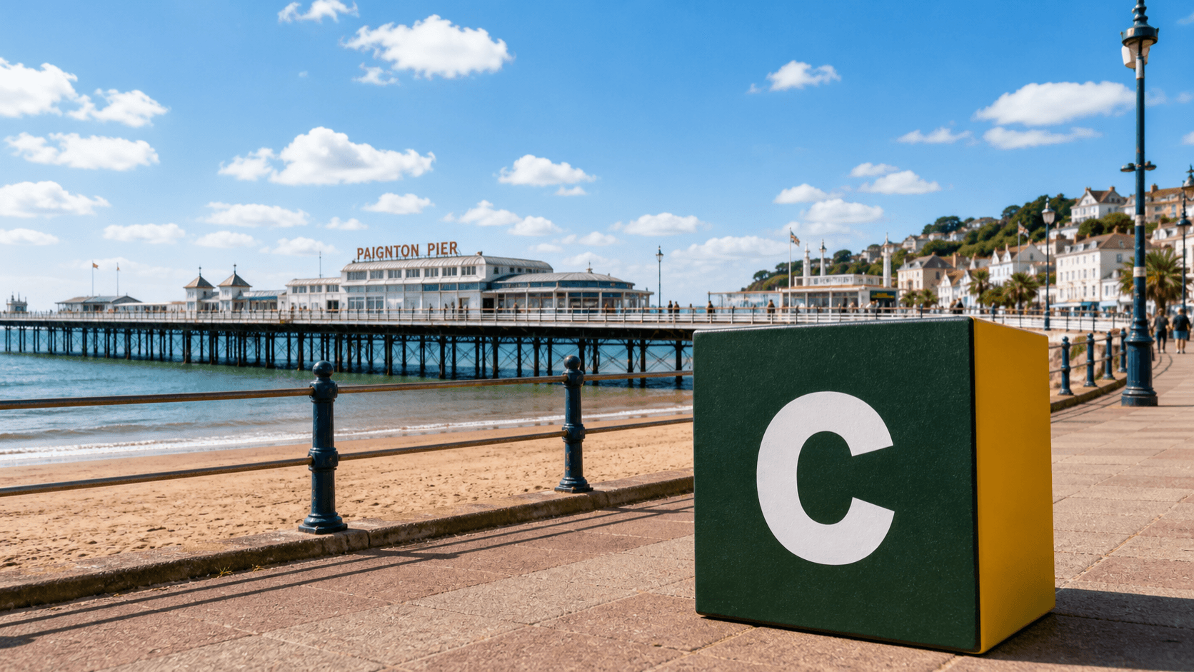 AI training in Paignton with a realistic Coaley Peak branded 3D cube at Paignton Pier and seafront