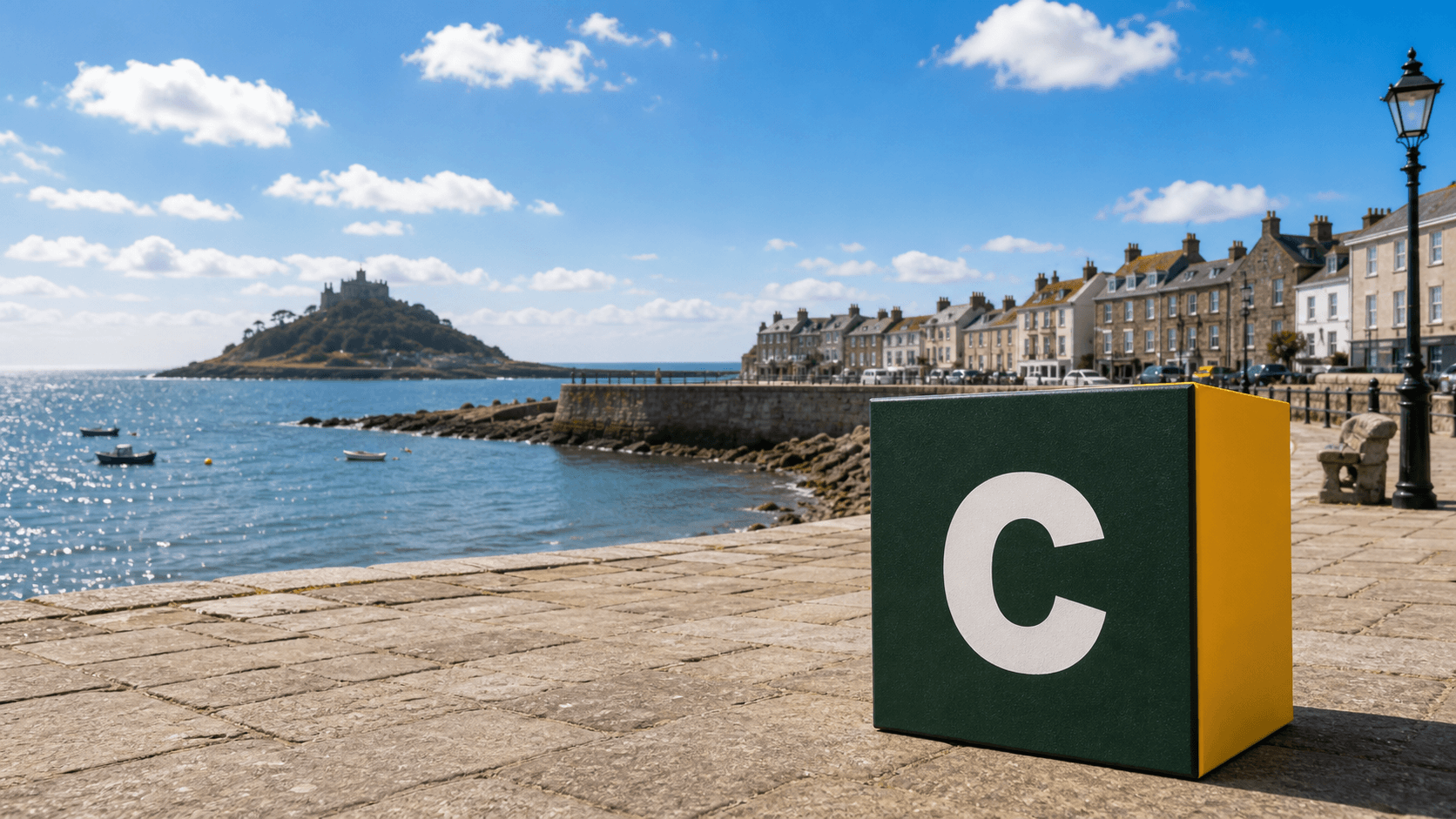 AI training in Penzance with a realistic Coaley Peak branded 3D cube at Penzance promenade and Mount's Bay