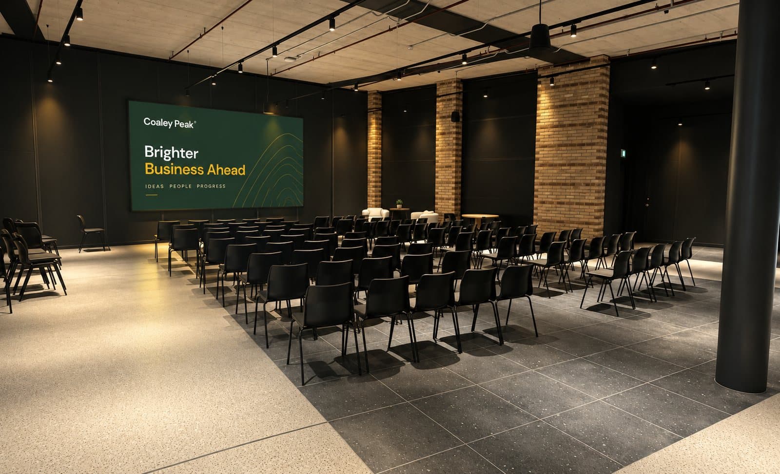 The event room at Foundervine Spaces, rows of seats facing a screen showing a Coaley Peak slide