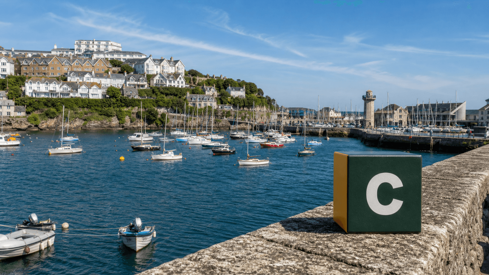 AI training in Falmouth by Coaley Peak AI training in Falmouth with a realistic Coaley Peak branded 3D cube at Falmouth Harbour