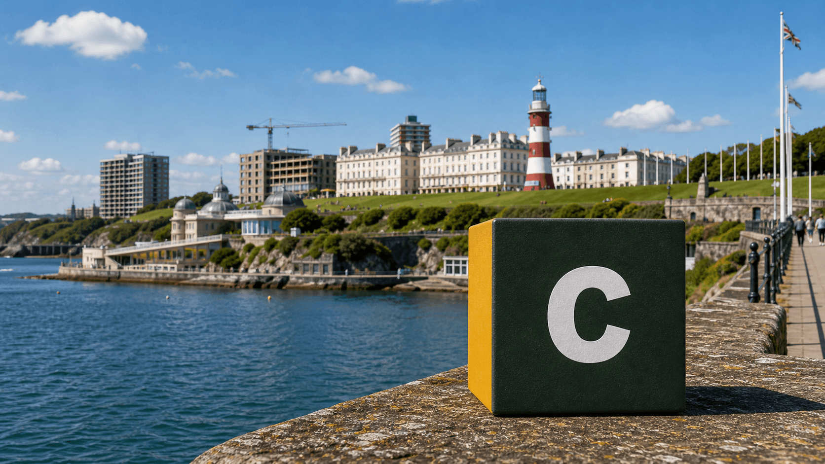 AI training in Plymouth by Coaley Peak AI training in Plymouth with a realistic Coaley Peak branded 3D cube at Plymouth Hoe and Smeaton's Tower