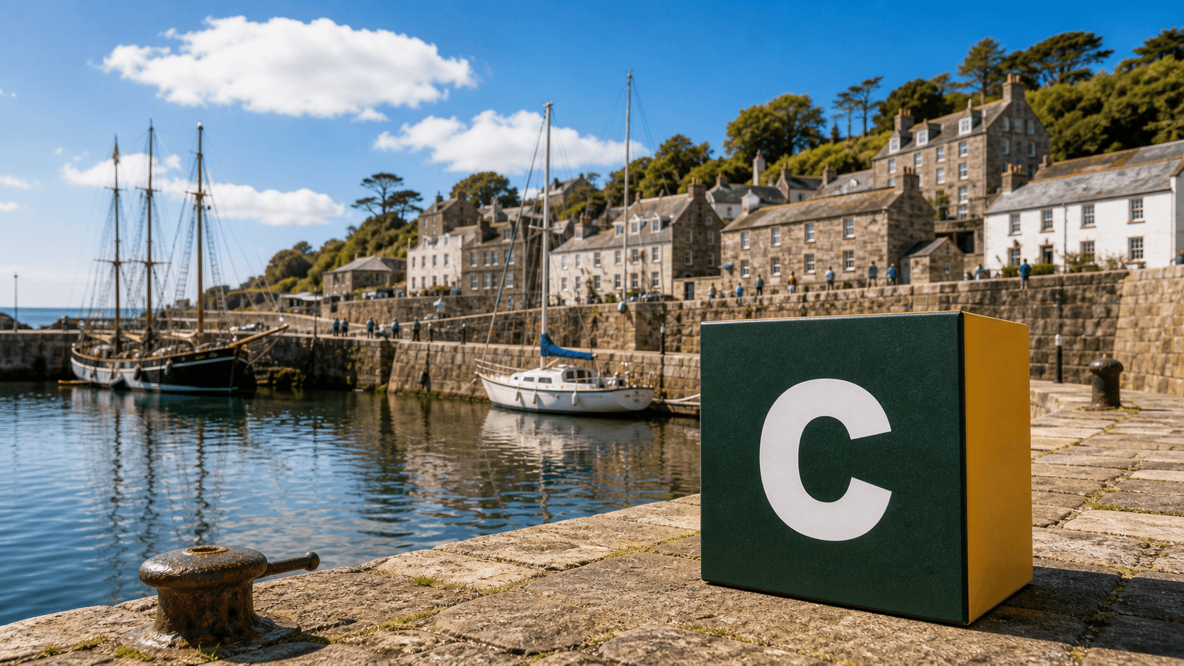 AI training in St Austell by Coaley Peak AI training in St Austell with a realistic Coaley Peak branded 3D cube at Charlestown Harbour near St Austell
